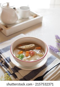 Kolak Or Indonesian Dessert For Breaking The Fast When Ramadan Month. Made From Pumpkin, Purple Sweet Potato, Sugar Palm Fruit, And Banana Cooked With Coconut Milk, Palm Sugar And Pandanus Leaves.