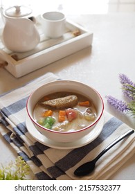 Kolak Or Indonesian Dessert For Breaking The Fast When Ramadan Month. Made From Pumpkin, Purple Sweet Potato, Sugar Palm Fruit, And Banana Cooked With Coconut Milk, Palm Sugar And Pandanus Leaves.