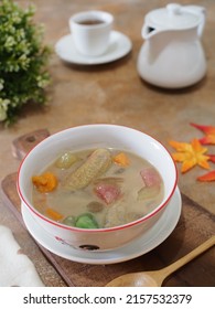 Kolak Or Indonesian Dessert For Breaking The Fast When Ramadan Month. Made From Pumpkin, Purple Sweet Potato, Sugar Palm Fruit, And Banana Cooked With Coconut Milk, Palm Sugar And Pandanus Leaves.