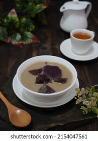 Kolak Ubi Ungu Or Indonesian Dessert For Breaking The Fast When Ramadan Month. Made From Japanese Purple Sweet Potato, Cooked With Coconut Milk, Palm Sugar And Pandanus Leaves. Dark Photography