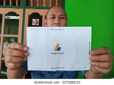 Kolaka, Indinesia - July 2022: Someone Shows Letter From Google Adsense