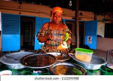Kolda, Senegal - June 19 2018: Woman Working With Food In A Senegalese City.