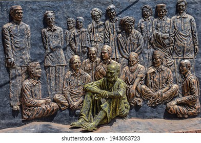 Kolhapur , Maharashtra India - March 15th 2020; Stock photo of mural art made up of clay and painted with black and golden color. pottering group of Indian freedom fighter at Kolhapur Maharashtra 
