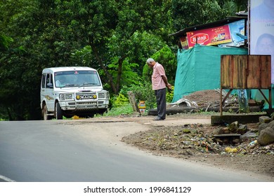 Kolhapur,Maharashtra,India-September 13th 2019;Stock photo of 50 to 60 aged old Indian man waiting for bus or public transport on early morning in a nearly by village bus stop at kolhapur India.