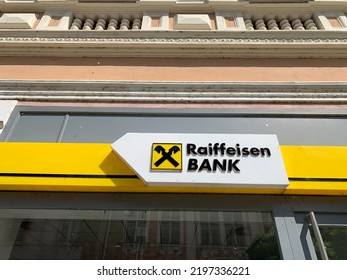 Kolin, Czech Republic - August 13, 2022: Raiffeisen Bank Name And Logo, Emblem Above Front Entrance To The Local Branch. International Financial And Retail Banking Institution.