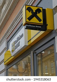 Kolin, Czech Republic - March 23 2021: Raiffeisen Bank branch with yellow colour including outdoor atm, sign with logo above window - Shutterstock ID 1945318063