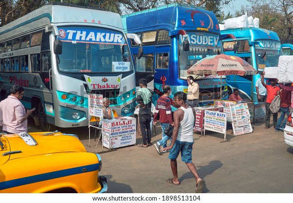 Kolkata, 01-09-2021: Crowd of \
bus booking agents\
and passengers, at Babughat, which is also one of the main bus\
terminus in city. Queue of long-distance luxury buses are seen\
parked at bus stand.