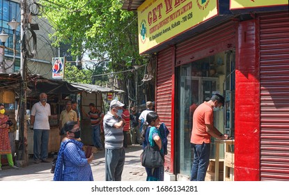 Kolkata, India, 03/27/2020: People In Long Queue Outside A Medicine Shop. There Has Been A Severe Shortage Of Essential Medicine, As Shop Owners/distributors Facing Shortage Of Staffs During Lockdown.