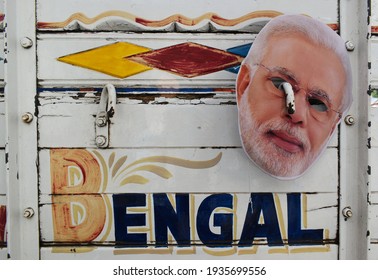 Kolkata, India, 07-03-2021 - A Mask Of Narendra Modi (Prime Minister Of India) Is Hanging On A Mini Truck At Kolkata.