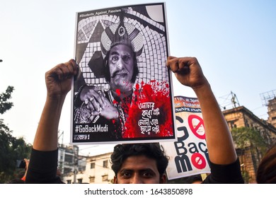 Kolkata, India, 11/1/2020- A man is Showing a poster on the protest rally against for the NRC and CAA in Kolkata, India.