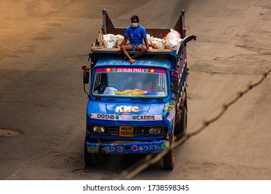 Kolkata, India - April 2020: Lockdown For COVID-19 - Man Sitting On Top Of A Truck