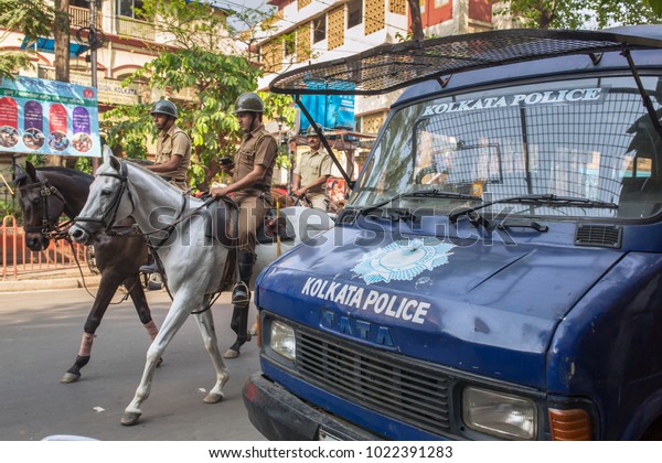 Kolkata, India -\
April 3, 2017: Horse mounted police patrolling streets in Kolkata\
downtown, West Bengal,\
India.