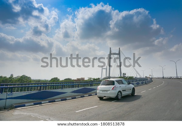 Kolkata, West Bengal, India - 23rd May 2020 :\
Blue sky with white clouds over 2nd Hoogly Bridge, connecting\
Howrah and Kolkata.