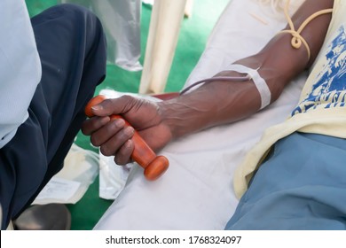 Kolkata, West Bengal, India - 25th February 2018 : Indian Male Volunteer Holding Dumbbell And Donating Blood At Blood Donation Camp.