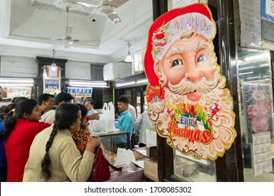 Kolkata, West Bengal, India - 29th December 2019 : Nahoum And Sons, New Market Area Is A Very Famous And Old Cake Shop. Customers Are Busy Buying Cakes Over The Sales Counter Inside The Shop.