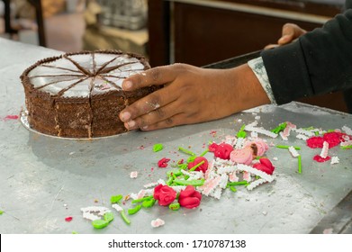 Kolkata, West Bengal, India - 29th December 2019 : Nahoum And Sons, New Market Area Is A Very Famous And Old Cake Shop. Sales People Are Busy Selling Cakes Over The Sales Counter Inside The Shop.