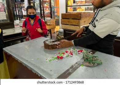 Kolkata, West Bengal, India - 29th December 2019 : Nahoum And Sons, New Market Area Is A Very Famous And Old Cake Shop. Sales People Are Busy Selling Cakes Over The Sales Counter Inside The Shop.