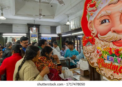 Kolkata, West Bengal, India - 29th December 2019 : Nahoum And Sons, New Market Area Is A Very Famous And Old Cake Shop. Customers Are Busy Buying Cakes Over The Sales Counter Inside The Shop.