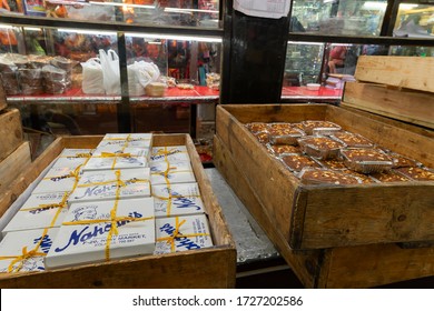 Kolkata, West Bengal, India - 29th December 2019 : Nahoum And Sons, New Market Area Is A Very Famous And Old Cake Shop. Sales People Are Busy Selling Cakes Over The Sales Counter Inside The Shop.