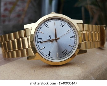 Kolkata, West Bengal, India - May 05 2021 : Titan Golden Wrist Watch