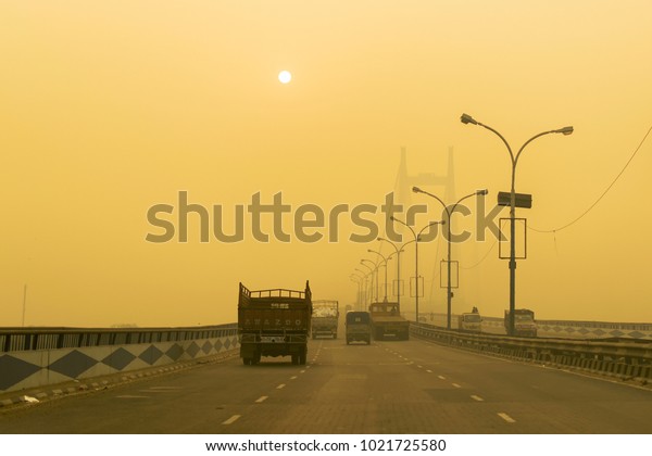 KOLKATA, WEST BENGAL , INDIA -\
NOVEMBER 27TH 2016 : Vidyasagar Setu (Bridge) over river Ganges,\
2nd Hooghly Bridge in Kolkata,West Bengal,India. Shot in winter\
morning.