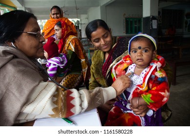 Kolkata, West Bengal/India - January 13, 2013: A woman and her child came to see a doctor in a health clinic of a charity for check up. 