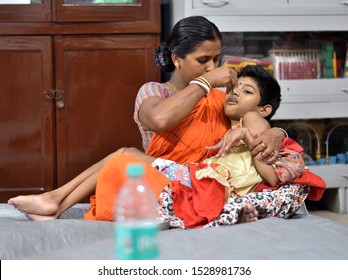 Kolkata,India,6/1/2018,MOTHER IS HELPING 9 YEARS OLD DAUGHTER(cp)TO TAKE FOOD.Children With Cerebral Palsy Often Have Trouble Swallowing All Of Their Food.