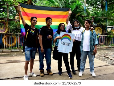 Kolkata,west Bengal,India 06.19.2022 A Lgbt Family Members Display A Rainbow Flag And Poster To Celebrate Their Identities Through Pride Month.