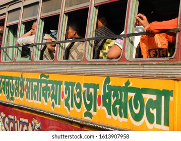 KOLKATA,WEST BENGAL/INDIA-MARCH 20 2018:Passengers Sit In A Crowded Public Bus Adorned With Colorful Hindi Writings On It's Side.