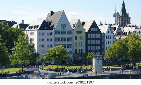 KOLN, GERMANY - Aug 20, 2011: The buildings of Cologne and people enjoying the sunny day outdoors in Germany