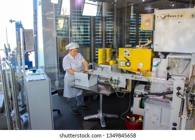 
Koln/ Germany - March 2017: Woman Packs Chocolate At A Chocolate Factory. The Work Of People In The Factory. Chocolate Production.
