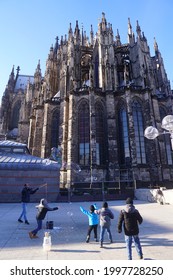 Koln, January 2019 - children having fun with the soap bubble in front of cologne cathedral