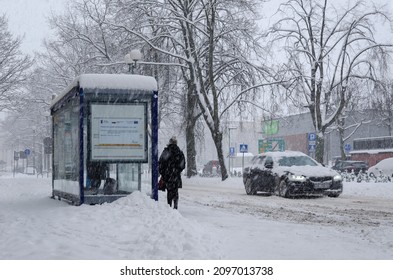 KOLOBRZEG, WEST POMERANIAN - POLAND - 2021: Snowstorm on Bus stop and the city streets are covered with a thick layer of snow 
