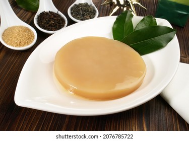 Kombucha Mushroom and Ingredients - SCOBY or Tea Fungus. A symbiotic growth of acetic acid bacteria and osmophilic yeast species.