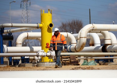 Komotini, Greece - 21 March, 2022: Worker is seen working near the construction site of the interconnected IGB natural gas transmission pipeline, starting at Komotini, Greece and ending at Bulgaria.