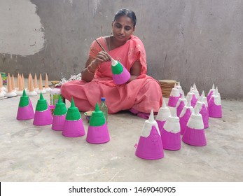 Kondapalli, Andhra Pradesh / India - July 16 2019: A Woman In Traditional Sari Paints Kondapalli Toys In The Backyard Of Her Home!