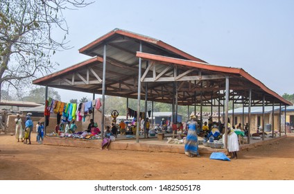 Kongo Village / Ghana - 02.24.2015: Local Fresh Market Building In Kongo Village, Rural Ghana. Vendors Selling And Wearing Local Fabrics Can Be Seen.