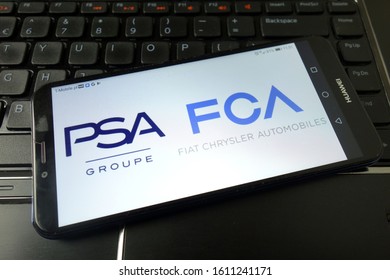 KONSKIE, POLAND - December 21, 2019: PSA and FCA logos displayed on mobile phone