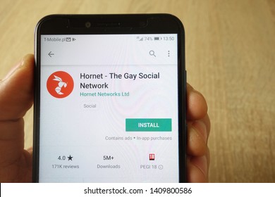 KONSKIE, POLAND - May 18, 2019: hand holding smartphone with Hornet - The Gay Social Network app on Google Play website displayed