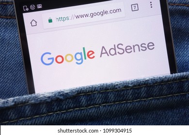 KONSKIE, POLAND - MAY 19, 2018: Google AdSense website displayed on smartphone hidden in jeans pocket