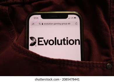 KONSKIE, POLAND - September 15, 2021: Evolution Gaming Group AB logo displayed on mobile phone hidden in jeans pocket