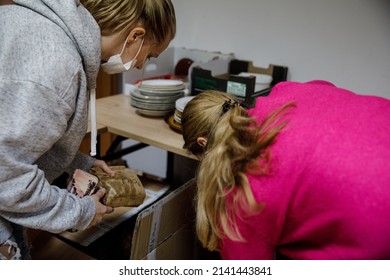 KONSTANCIN-JEZIORNA, POLAND - 22 MARCH 2022: Volunteers Sort Pet Food At Donation Point For Ukrainian War Refugees