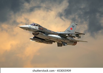 KONYA, TURKEY - CIRCA MAY, 2015: Turkish Air Force General Dynamics Lockheed Martin F-16 Fighting Falcon fighter bomber jet aircraft flying against dramatic stormy sky detail exterior close up view