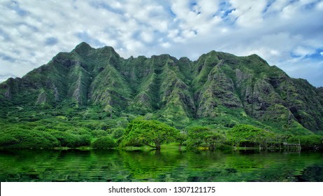 Koolau Range reflection with water in Oahu island, Hawaii USA