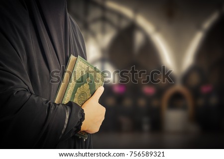 Koran in hand - holy book of Muslims( public item of all muslims )Koran in hand muslims
