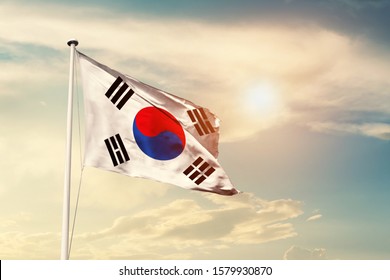 Korea South national flag cloth fabric waving on the sky with beautiful sun light - Image