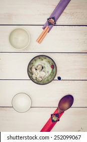 Korean Chopsticks, Wooden Spoon And Small Traditional Plates