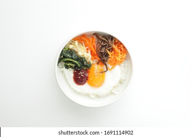 Korean comfort food, bibimbap vegetable and sunny side up mixed rice