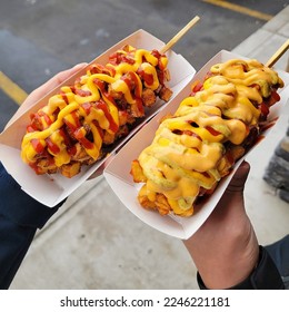 Korean Corn Dogs with Batter and Fried Potatoes Delicious Hot Dog Street Food - Powered by Shutterstock