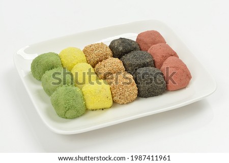 Korean food Five-Colored Gyeongdan Tteok(rice ball cake) on a white dish with background, South Korea
